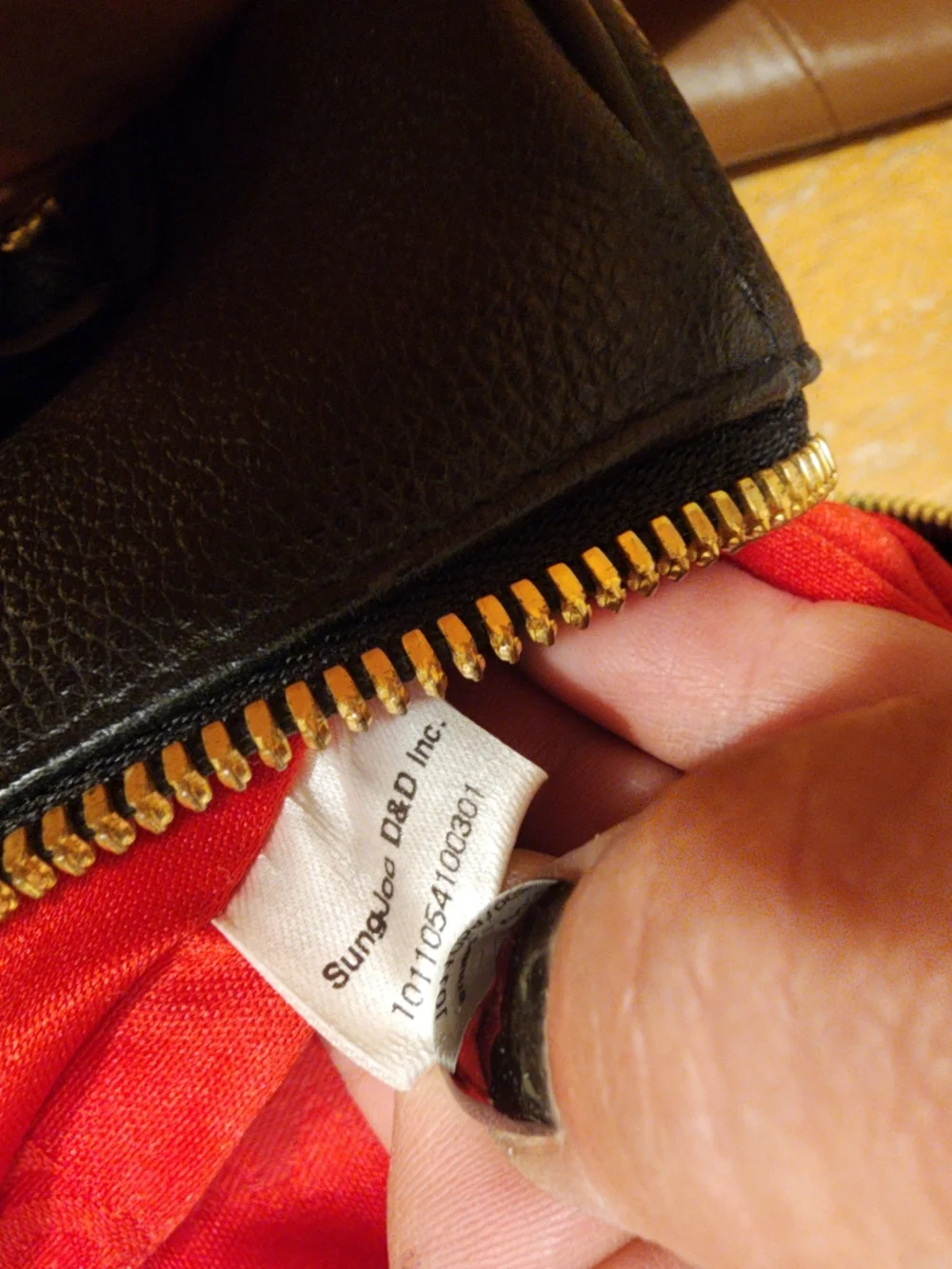 MCM Black Leather Boston Bag featuring polished gold-tone hardware